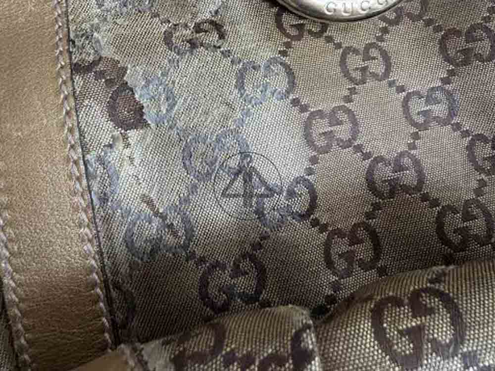 Túi gucci bị trong tróc